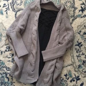 Gray sweeter and black cross neck t shirt